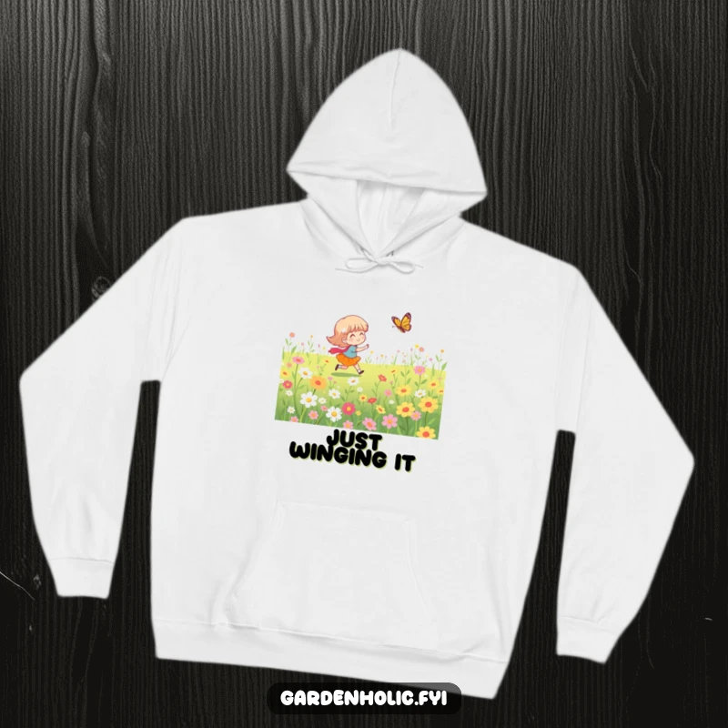 Funny hoodie depicting a character enthusiastically chasing a butterfly through a blooming flower field, capturing a moment of pure delight.