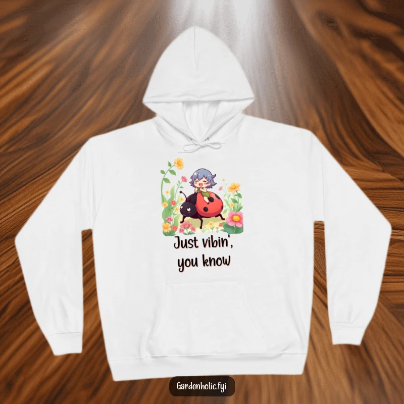 Funny hoodie showing a gleeful character on a giant ladybug, embarking on an epic garden escapade, radiating pure happiness.